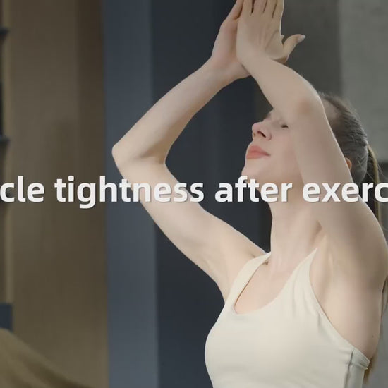 A woman stretching to relieve muscle tightness after exercise, promoting recovery with a massage gun deep tissue with heat and cold