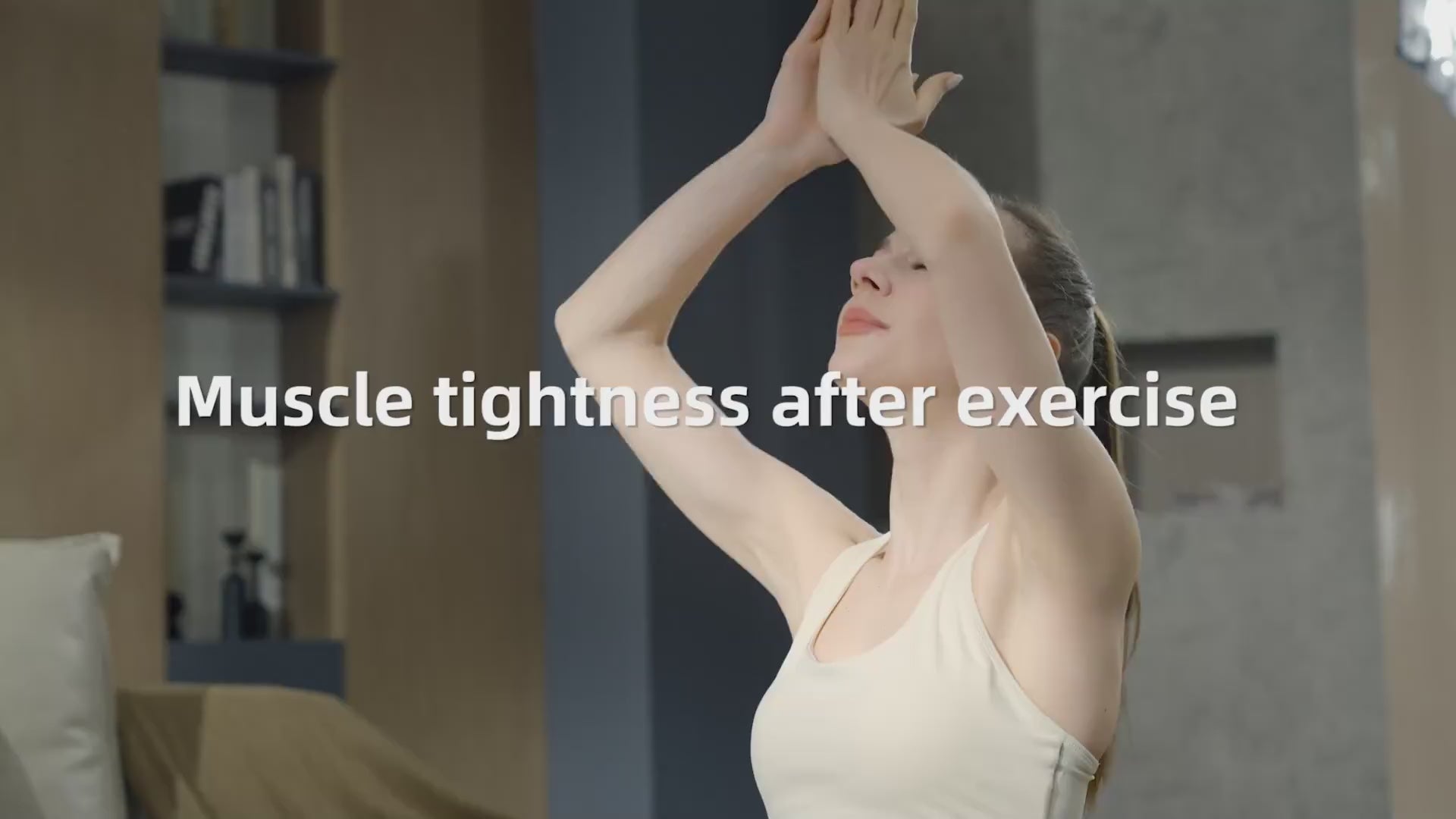 A woman stretching to relieve muscle tightness after exercise, promoting recovery with a massage gun deep tissue with heat and cold
